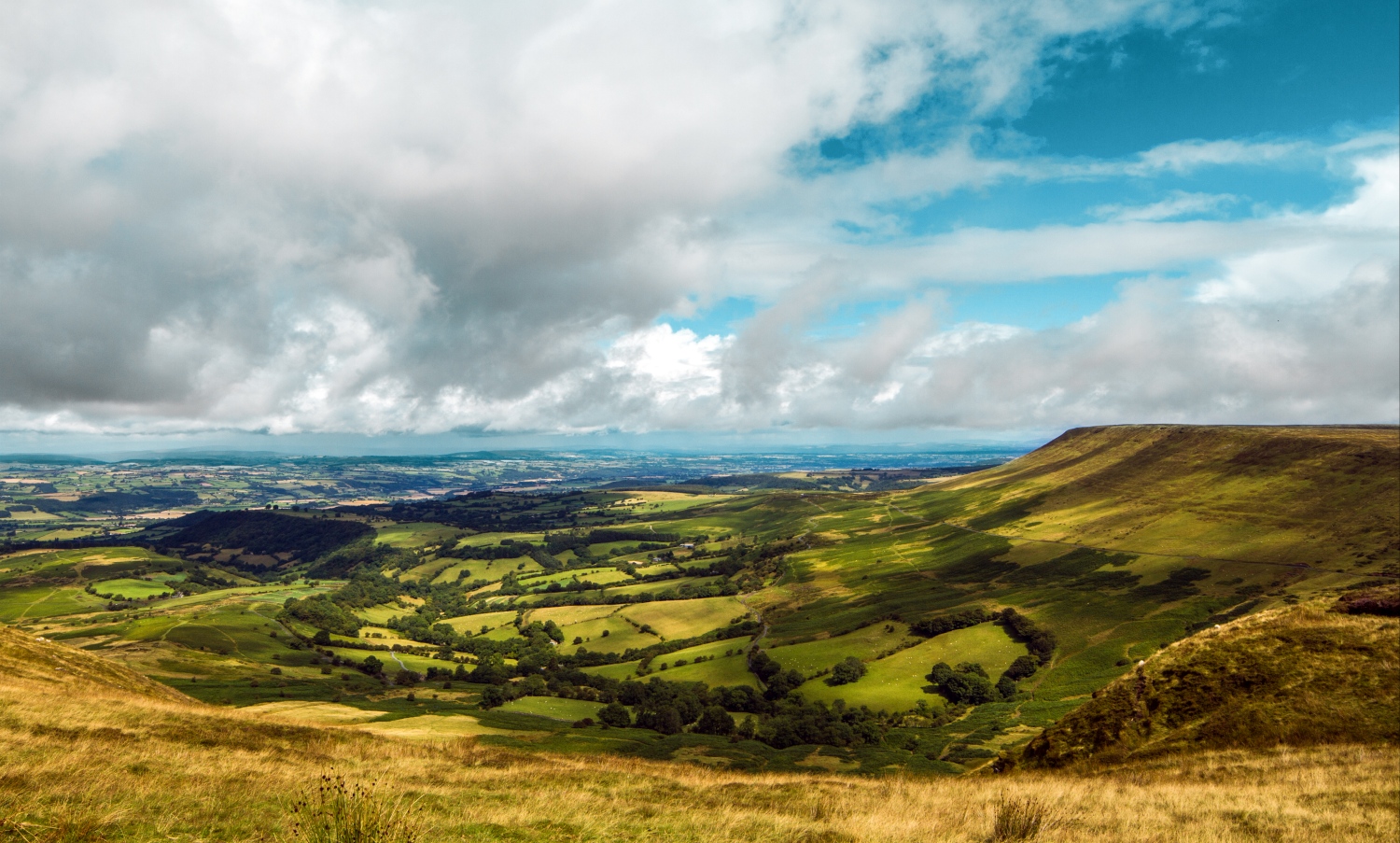 View across green fields, blue sky with clouds - Hay Bluff, The Black Mountains